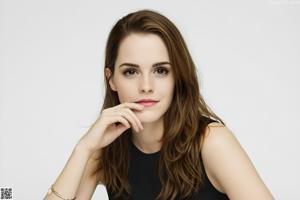 A young woman sitting on top of a white couch.