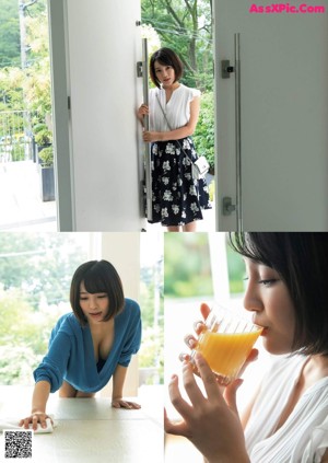 A woman holding a glass of orange juice in front of a door.